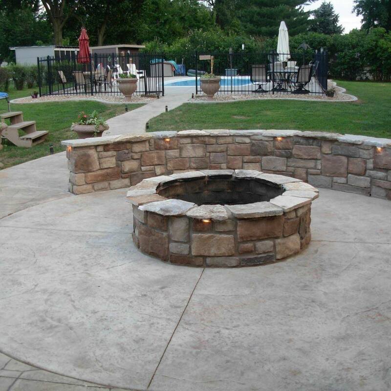 Abilene Concrete Services Patio with swimming pool and fire pit.